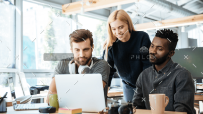 demo-attachment-944-happy-colleagues-sitting-in-office-coworking-PHYA6TG